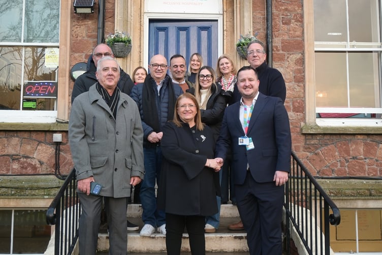 Aurora Foxes principal Mark Costello welcomes former Malta president Marie-Louise Coleiro Preca and her delegation to Minehead.