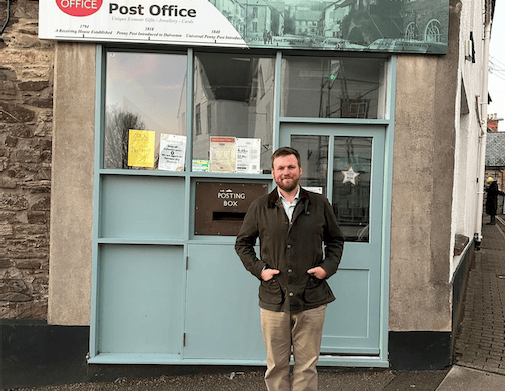 Exmoor campaigner James Wright outside Dulverton Post Office after the Government reversed a policy which could have seen thousands of branches close.