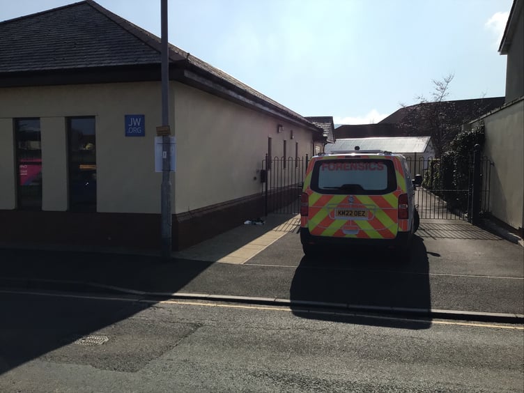 A police forensics team was seen at the Jehovah's Witnesses Kingdom Hall, in Minehead, after a second graffiti attack in a fortnight.