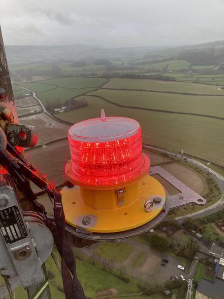 The repaired Washford Cross transmitting mast warning light with the West Somerset landscape 500 feet below.