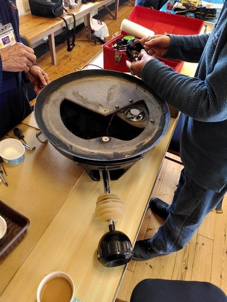 A Dalek head being repaired by Porlock Repair Café volunteers.