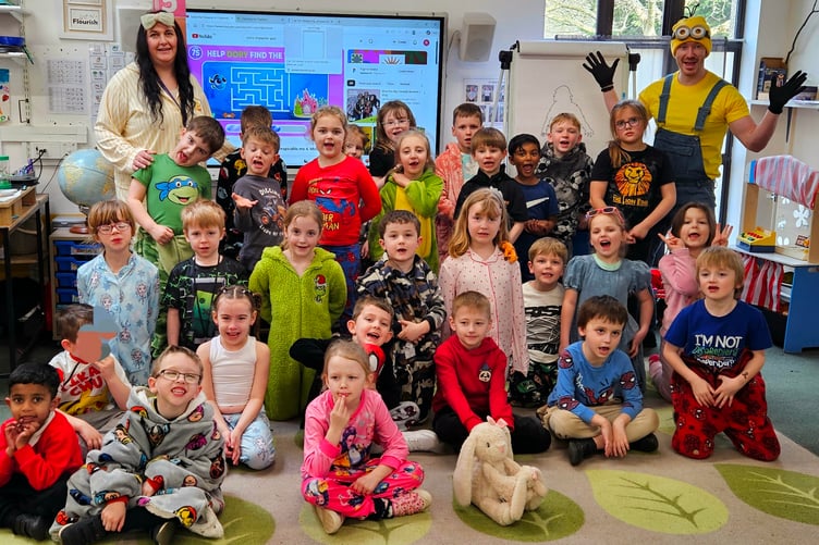 Pupils of St Peter's First School, Williton, listened to stories in their pyjamas for world book day.