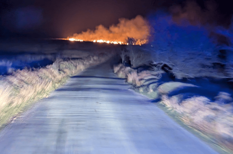 Friday night's blaze on Anstey Common can be seen as firefighters approach the scene.