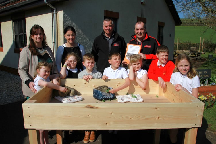 Pictured with St Peter’s School’s new guinea pig runs are (left to right): headteacher Maida White, year four class teacher Catherine Gibbons, and Rob Harris and Stuart Davies, from CRS, with pupils Scarlett Leete, May Smith, Kyan Howard, Archie Clarke, Rosie Wall, Teddy Kingdon, and Isabelle Knowles. PHOTO: George Ody.