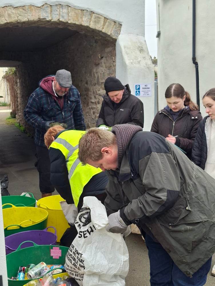Volunteers back at The Sanctuary, in Watchet, sort the litter collected from the town'd beach clean.