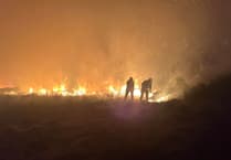 Serial arsonist strikes again as moorland blaze spreads over mile & closes main road