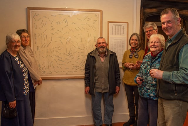 Villagers in Crowcombe attending the unveiling of the restored ‘Electricity Fund Signature Cloth’.