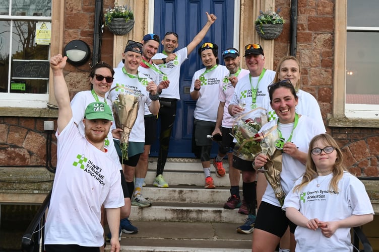 Some of the Aurora Foxes students and staff who took part in a 21-mile collective walk to support the charity Down's Syndrome Association.