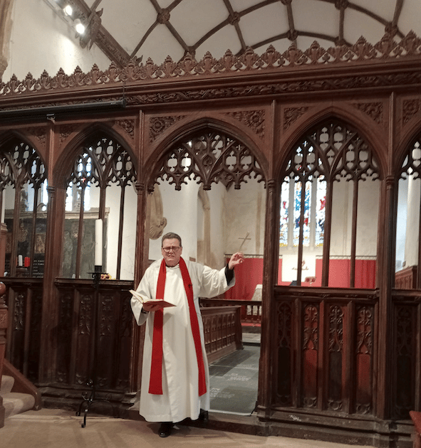 The Rev Mark Phillips blesses a Palm Cross in St Decuman's Church, Watchet.