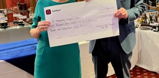 Cheque for nearly £10,000 presented to hospice by golf club 