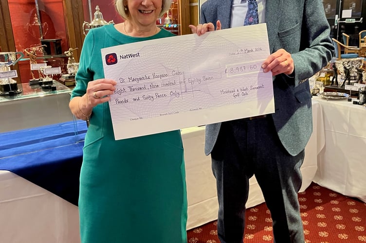 Lady Captain Pat Lucas presents a cheque for £8,9760.60 to Jonathan Langdon VP St Margaret's Hospice, Taunton.