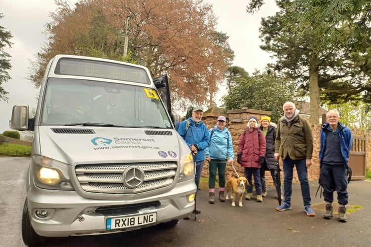 Members and friends of the Wivey-Welly Bus Users Group alight in Langford Buville for a 'bus walk' to celebrate the first anniversary of the bus service between Wellington and Wiveliscombe.