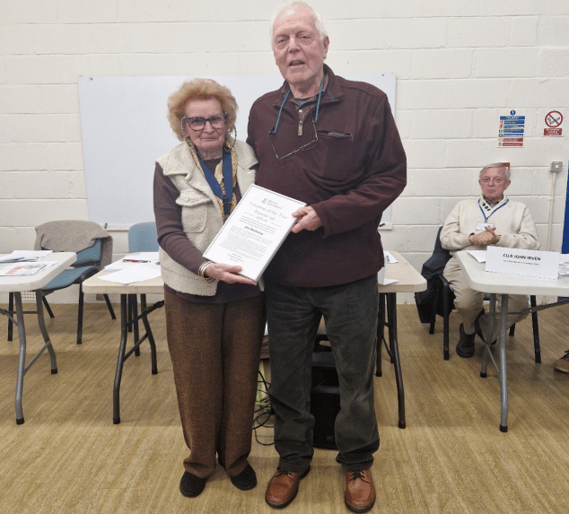 Watchet 'Volunteer of the Year' runner-up Jim Nicholas receives a certificate from the mayor Cllr Loretta Whetlor.