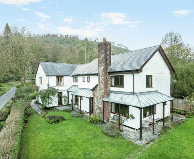 Idyllic property for sale with stream bordered gardens