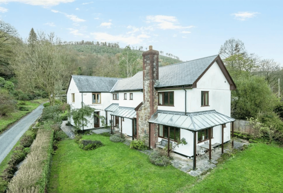 Idyllic property for sale with stream bordered gardens