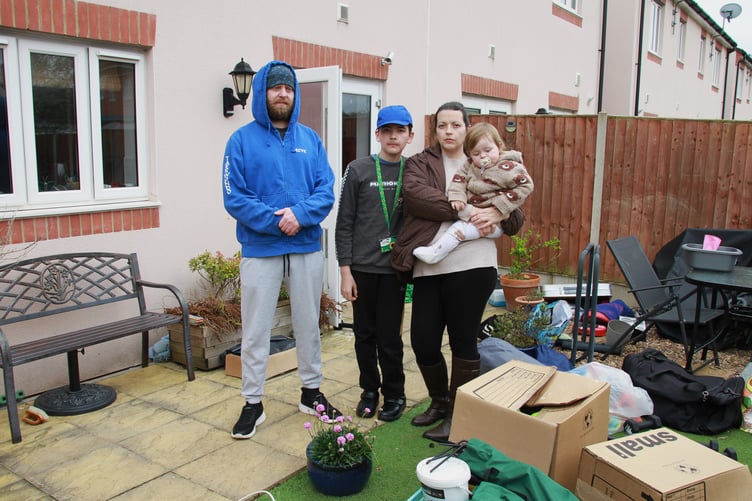 Steve and Samantha Ford with children Liam and Björn outside their Williton home. PHOTO: George Ody.