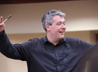 Village to welcome conductor's return