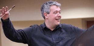 Village to welcome conductor's return