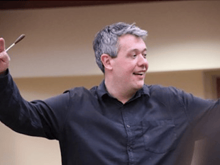 Village to welcome conductor's return