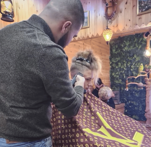 Theo's locks come off thanks to Minehead's Reds Barber Shop.