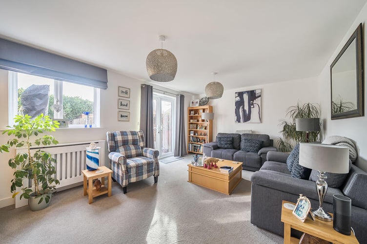 The generous sitting room expands the width of the house