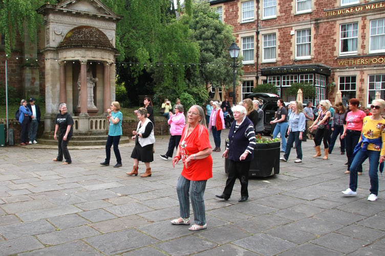 The Line Dance Foundation put out a worldwide call for dancers to perform at 1 pm on Saturday, May 2, and more than 50 from the Minehead area responded. PHOTO: George Ody.