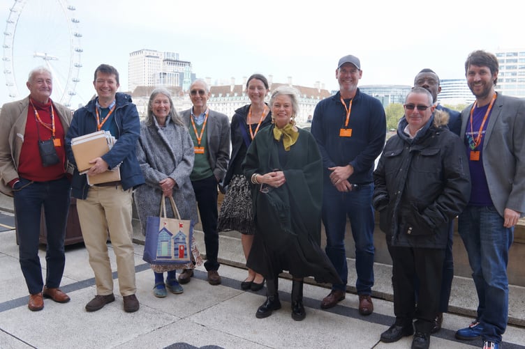 West Somerset MP Rachel Gilmour (centre) with some of the families who were in the public gallery for her Westminster Hall debate on child abduction abroad by a parent.