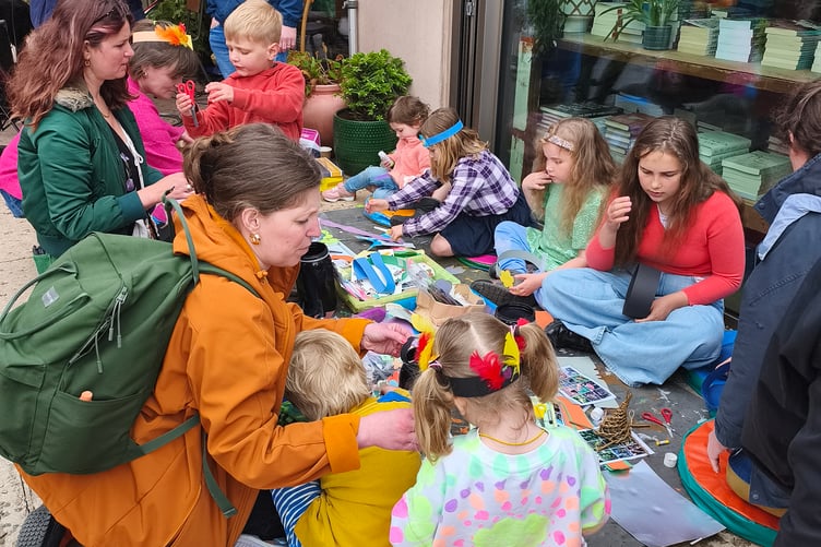 Children making colourful headbands in the East Quay courtyard