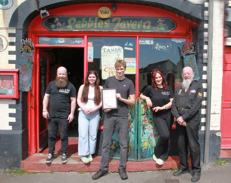 Pictured are (left to right) Pebbles Tavern landlord Sean Graham, Rosie Clayton, Joel Bradford, Tyler Johnson, and Somerset CAMRA chairman Mick Cleveland. PHOTO: George Ody.