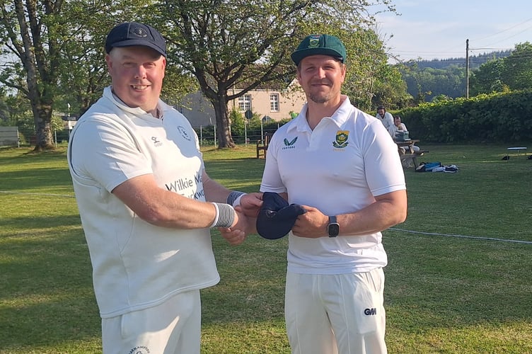 Matt Long (left) presents Ben Allerton with his Carhampton cap