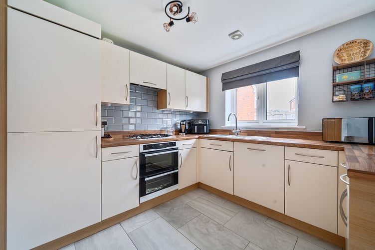 There is an open plan kitchen/dining room with a fully fitted kitchen