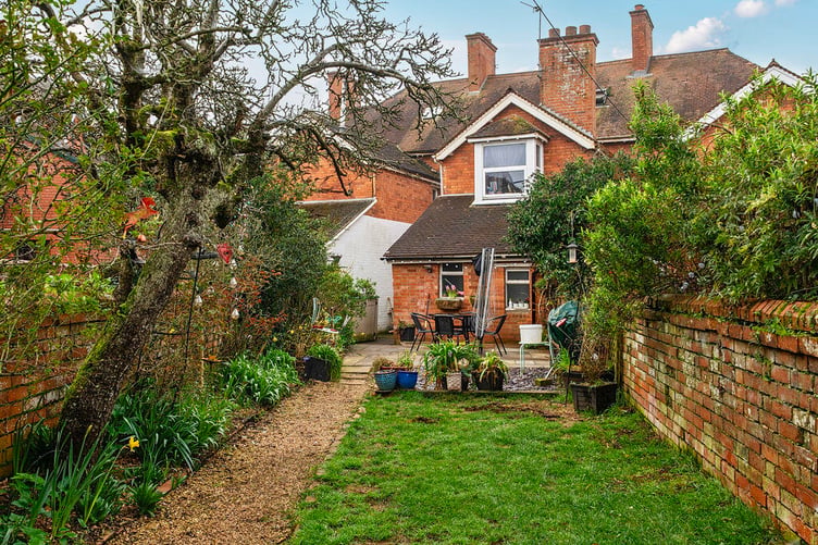 The property benefits from a level, walled garden