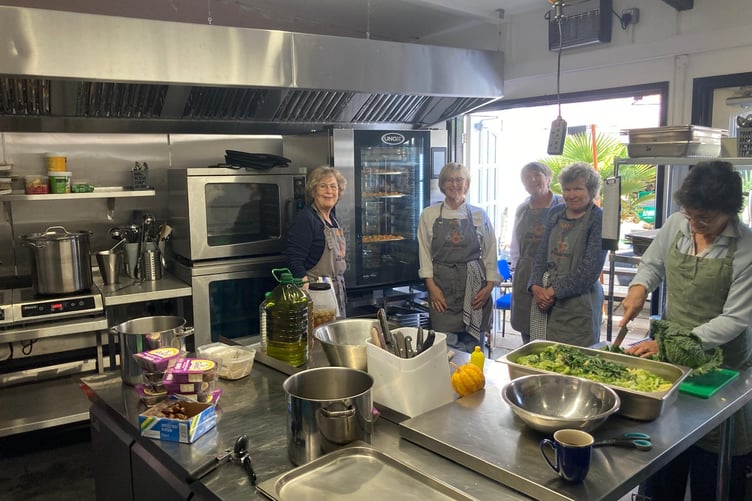 The sparkling kitchen with head chefs, left to right, Ilana Alder, Kate Benson, Zoe Walters, Sarah Heard, and volunteer Di Blythe.