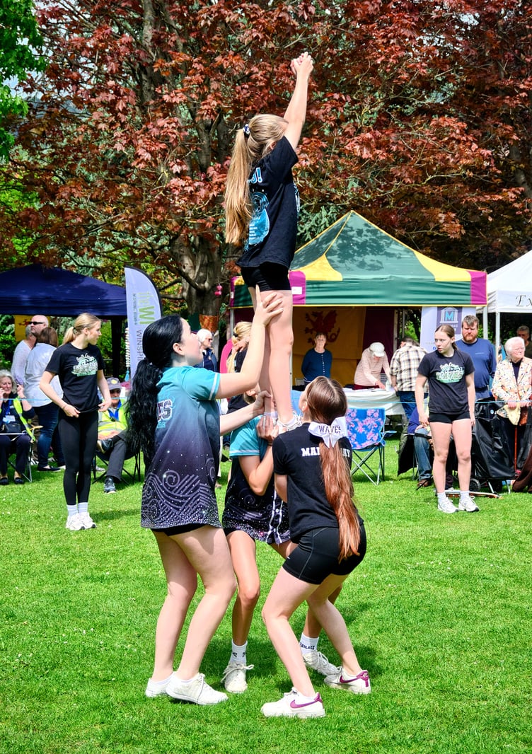 'Party in Park' daring moves by South Coast Waves cheerleaders. PHOTO: Richard Robbins.