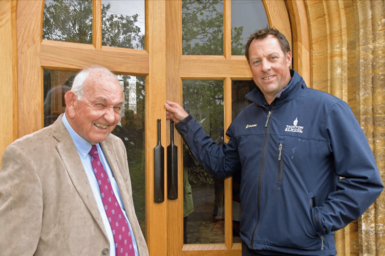 Former England and Somerset cricketer Marcus Trescothick outside Bicknoller Parish Churc's new 'Harold Gimblett Doors' with Free Press cricket correspondent Richard Walsh. PHOTO: Alain Lockyer.