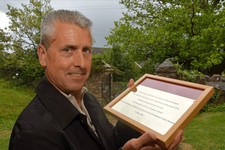 Harold Gimblett’s grandson Richard Gimblett with a brass plaque of dedication which will be attached to the back of one of the new doors in St George's Church, Bicknoller. PHOTO: Alain Lockyer.