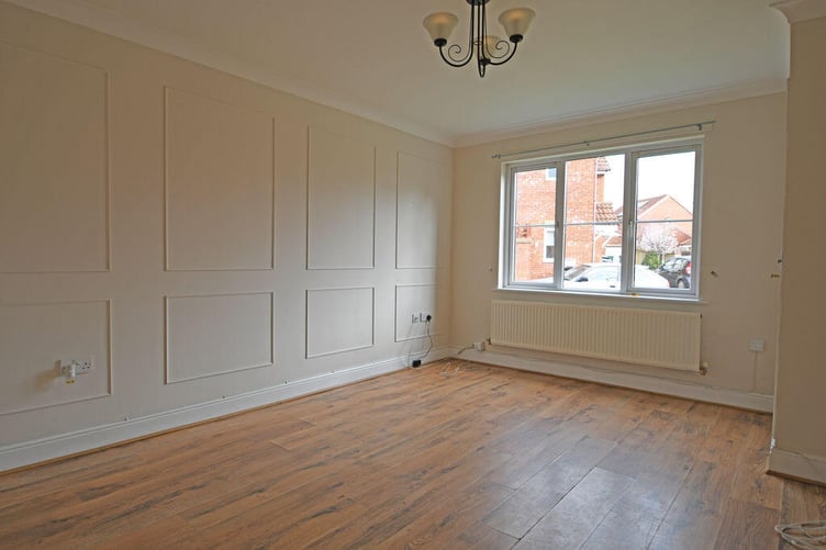 The good size living room leads into an inner lobby