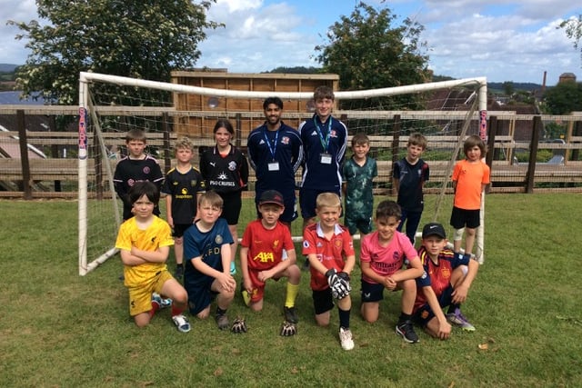 Standing, left to right, are Jacob, Oscar, Freya, coaches Neil Quessou and Russ Bracey, Eric, Ben, Arlo. Kneeling, left to right, are Sol, Reggie, Noah, Joseph, Quinny, Arthur