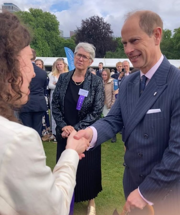 Minehead Aurora Foxes student Ella chats to the Duke of Edinburgh during an awards presentation in Buckingham Palace.