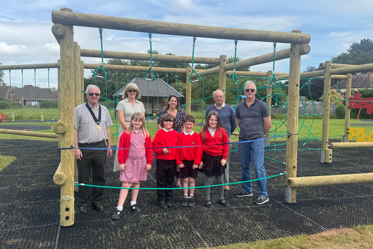 New children's play equipment in Williton has been officially declared open by a group of St Peter's First School pupils with parish councillors and staff.
