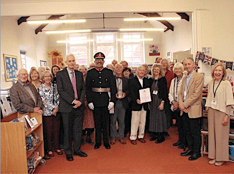 Somerset Lord Lieutenant Mohammed Saddiq and Deputy Lord Lieutenant Tom Mayberry are flanked by library volunteers and community representatives at the KAVS presentation in Nether Stowey.