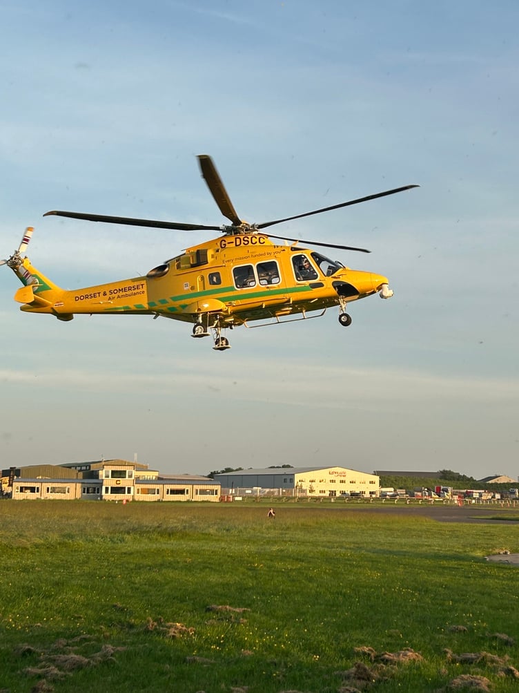 A second helicopter, G-DSCC, arrives at the Dorset and Somerset Air Ambulance airbase.