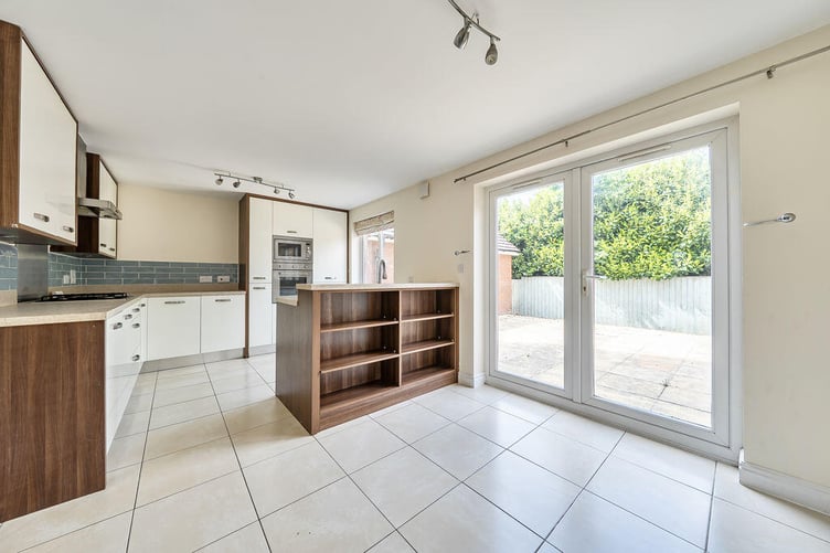 The generous kitchen/dining room is positioned at the rear of the property