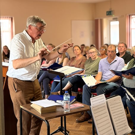 Conductor David Pitts with some of the performers in rehearsal for The Concert.