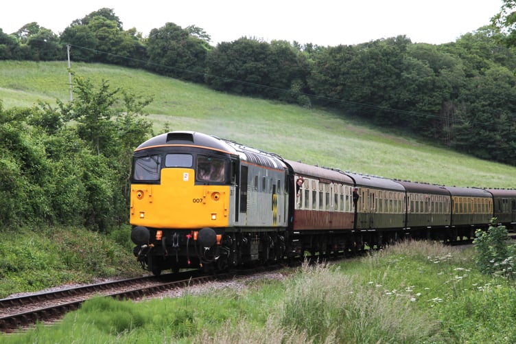 Guest Class 26 diesel locomotive 26007 hauls passengers during the West Somerset Railway's summer diesel festival. PHOTO: George Ody.