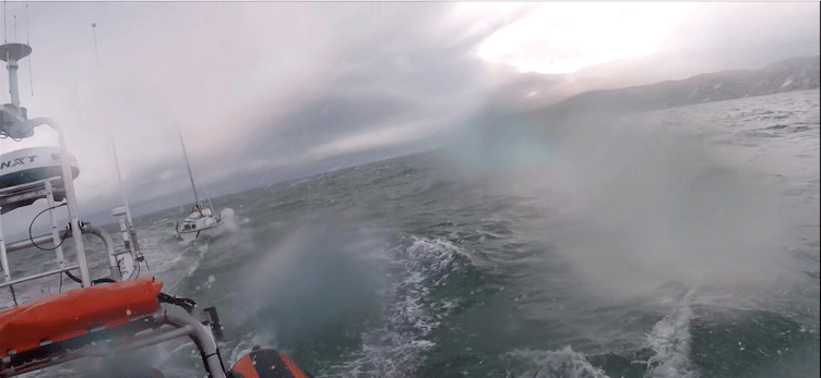 One of the yachts being towed to safety by Minehead's Atlanta-class lifeboat.
