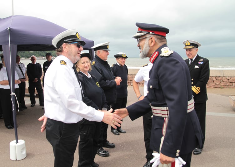Minehead National Coastwatch Station deputy manager Malcolm Oyston welcomes Somerset Lord Lieutenant Mohammed Saddiq, who visited to perform the official opening. PHOTO: George Ody.