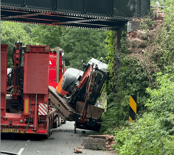Motorists stop train as bridge is damaged by lorry