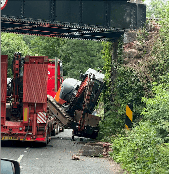 Motorists stop train as bridge is damaged by lorry