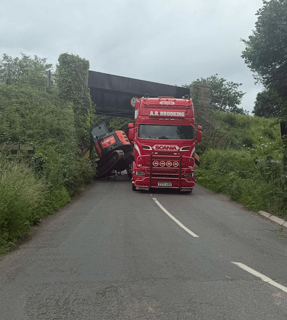 A mini digger toppled off a low loader lorry and damaged Watersmeet bridge on the West Somerset Railway.